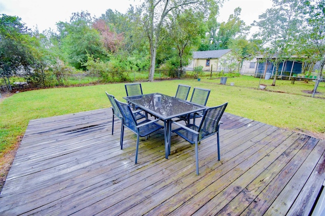 wooden deck featuring a yard