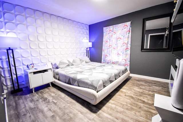 bedroom featuring wood-type flooring