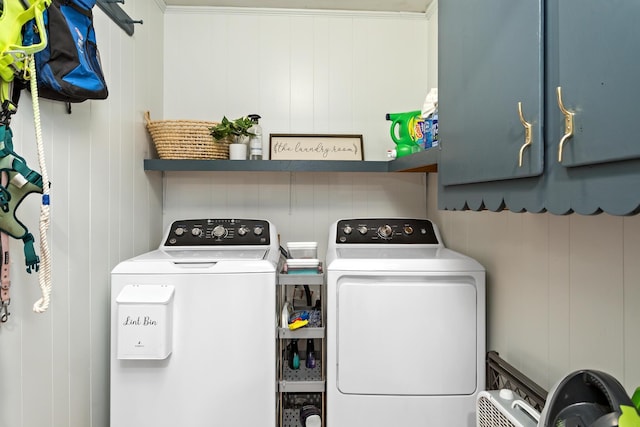 laundry area with washer and dryer and cabinet space