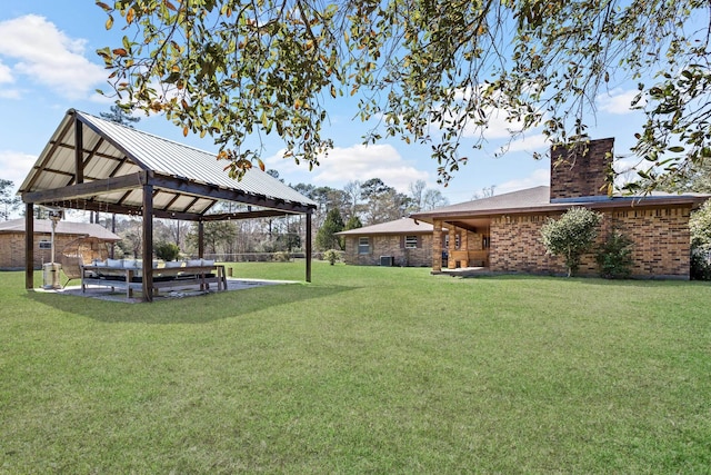 view of yard with a gazebo and a patio