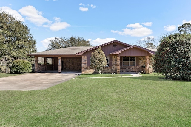 single story home with brick siding, an attached carport, concrete driveway, and a front yard