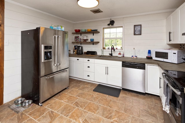 kitchen featuring white cabinetry, sink, and stainless steel appliances