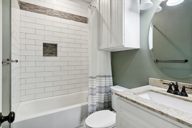 full bathroom featuring vanity, shower / bath combo, and toilet