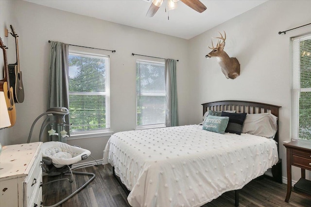 bedroom featuring ceiling fan and dark wood-type flooring