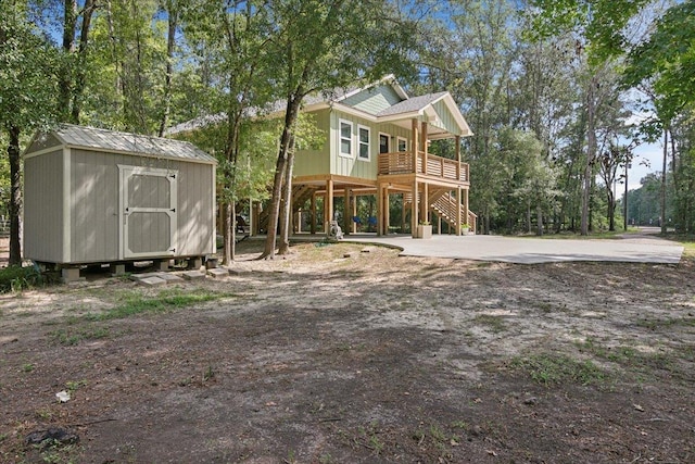 view of front of property with a storage shed