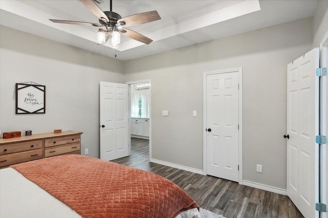 bedroom with ceiling fan, dark wood-type flooring, and ornamental molding