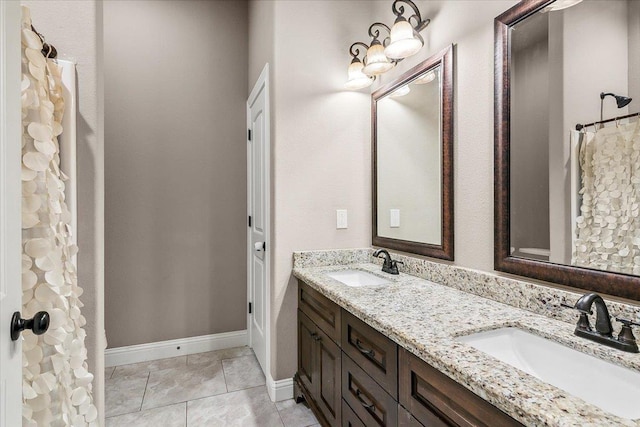 1390 Kalas Cir, Lumberton, TX 77657 - full bath featuring double vanity, baseboards, and tile patterned flooring