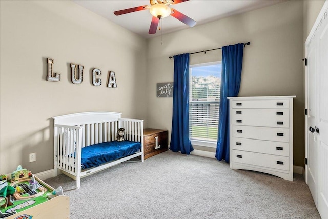 bedroom featuring ceiling fan and light carpet