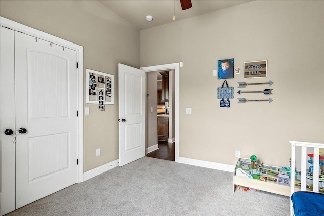 recreation room with carpet floors and ceiling fan