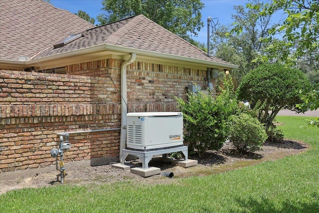 4711 Burns Cir, Orange, TX 77630 - exterior view of a power unit, brick siding, roof with shingles, a downspout, and gutters