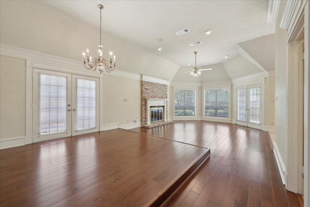 4711 Burns Cir, Orange, TX 77630 - unfurnished living room featuring a ceiling fan, vaulted ceiling, a chandelier, french doors, and dark wood-type flooring