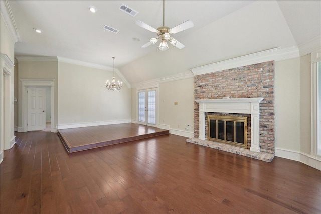 4711 Burns Cir, Orange, TX 77630 - unfurnished living room with ceiling fan, a chandelier, hardwood / wood-style floors, a fireplace, and lofted ceiling