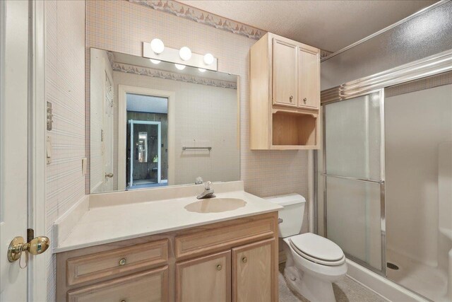 4711 Burns Cir, Orange, TX 77630 - full bathroom with a shower stall, vanity, and toilet