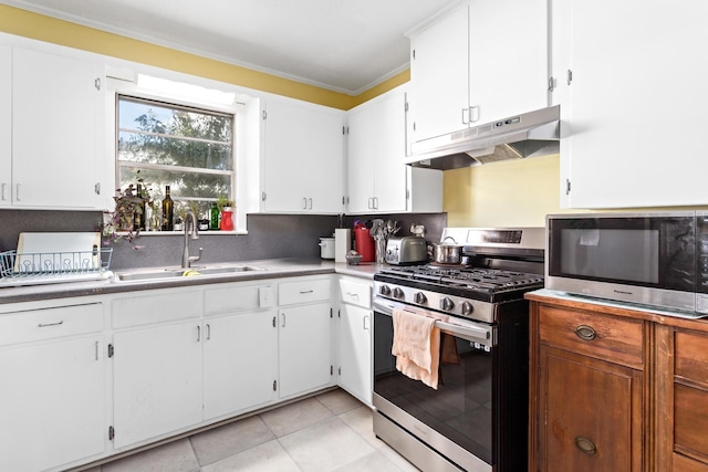 kitchen featuring white cabinetry, crown molding, a sink, stainless steel appliances, and under cabinet range hood