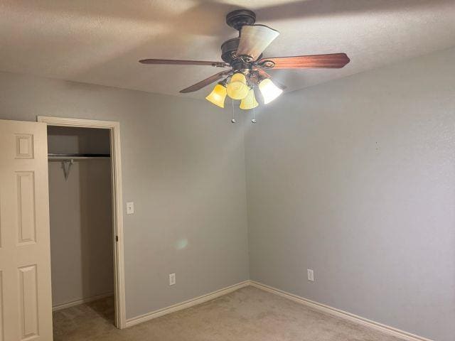 2985 Willow Pl, Beaumont, TX 77707 - unfurnished bedroom featuring light colored carpet, a closet, and ceiling fan