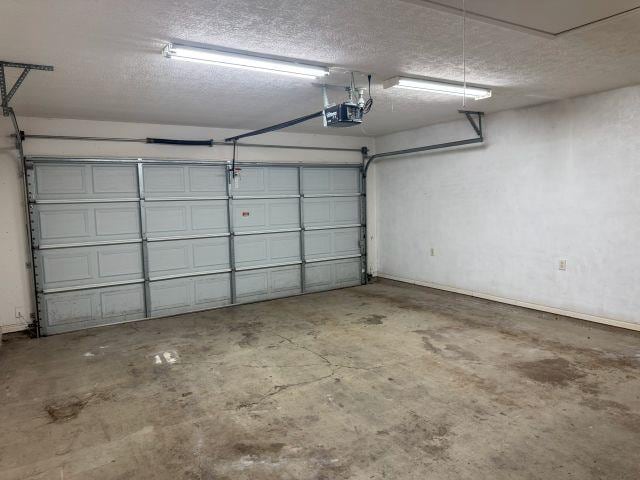 2985 Willow Pl, Beaumont, TX 77707 - garage featuring a garage door opener
