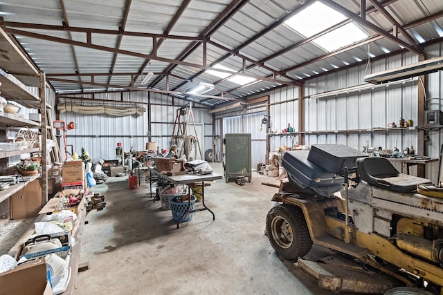garage featuring a workshop area and metal wall