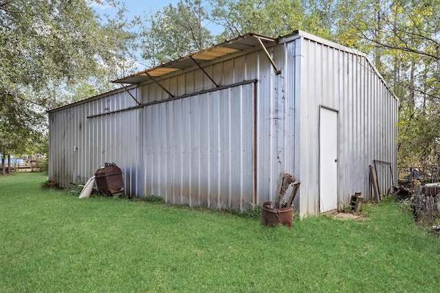 view of pole building with a lawn