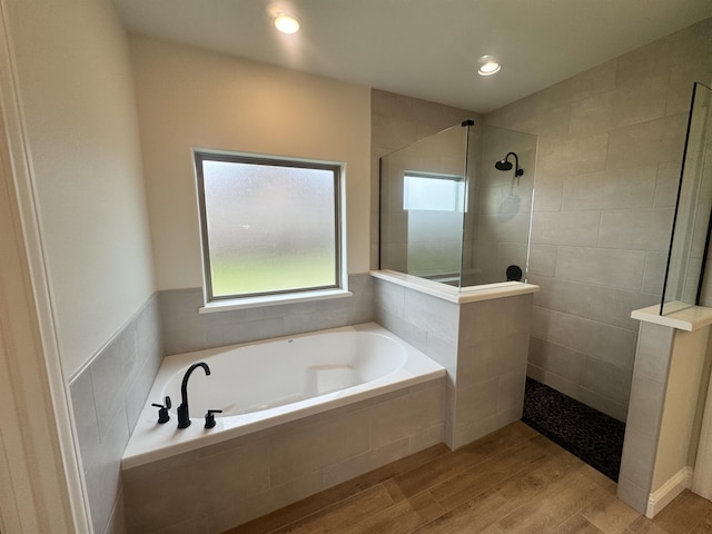 14865 Norma Jane Ln, Beaumont, TX 77713 - bathroom featuring a bath, walk in shower, wood finished floors, and recessed lighting