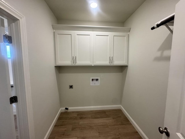 14865 Norma Jane Ln, Beaumont, TX 77713 - laundry area with hookup for a washing machine, dark wood-style floors, electric dryer hookup, baseboards, and cabinet space