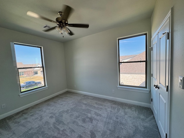14865 Norma Jane Ln, Beaumont, TX 77713 - spare room with healthy amount of natural light, carpet flooring, and baseboards