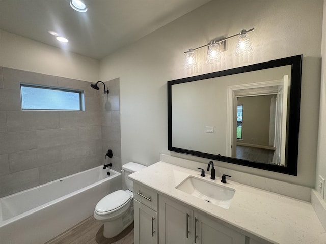 14865 Norma Jane Ln, Beaumont, TX 77713 - bathroom featuring toilet, washtub / shower combination, and vanity