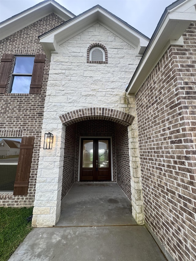 14865 Norma Jane Ln, Beaumont, TX 77713 - view of exterior entry featuring french doors and stone siding