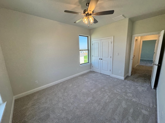 14865 Norma Jane Ln, Beaumont, TX 77713 - unfurnished bedroom with carpet floors, baseboards, a closet, and ceiling fan