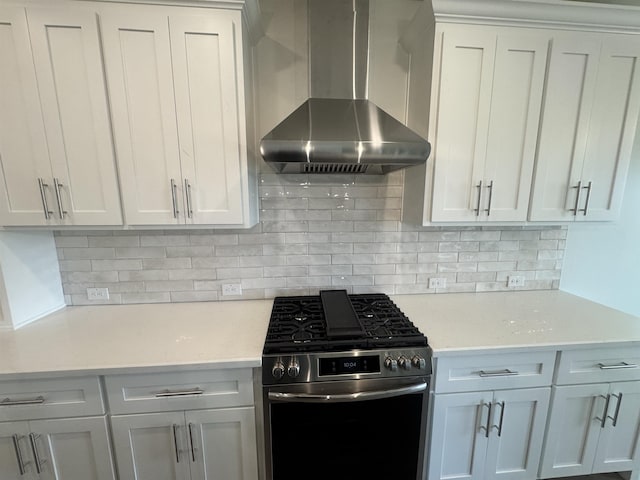 14865 Norma Jane Ln, Beaumont, TX 77713 - kitchen featuring stainless steel gas stove, wall chimney exhaust hood, light countertops, and tasteful backsplash
