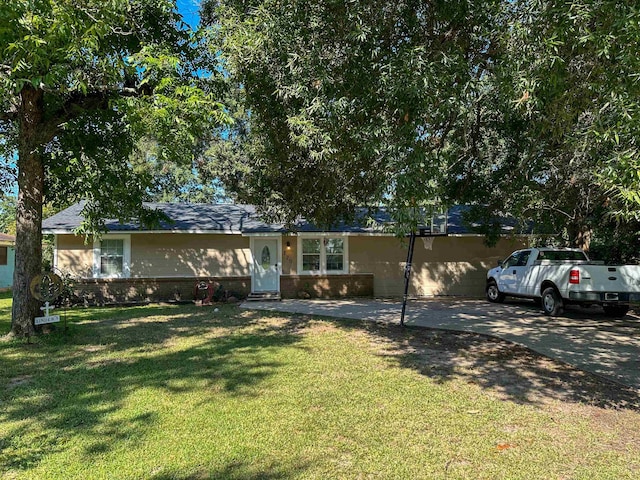 ranch-style house with a front lawn