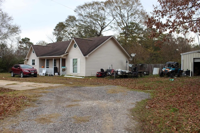 view of side of home featuring a porch