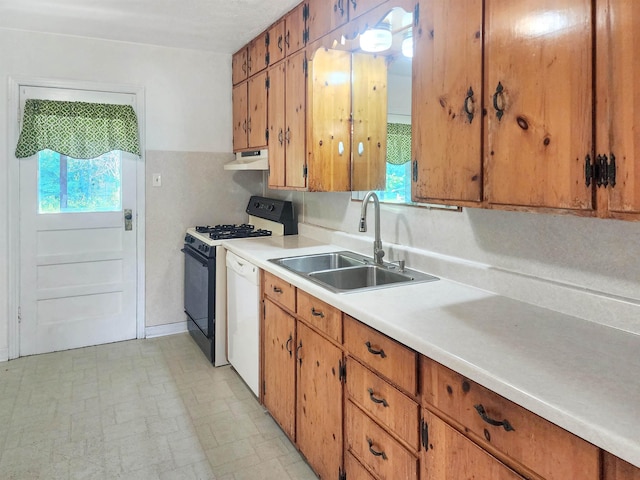 kitchen featuring white appliances and sink