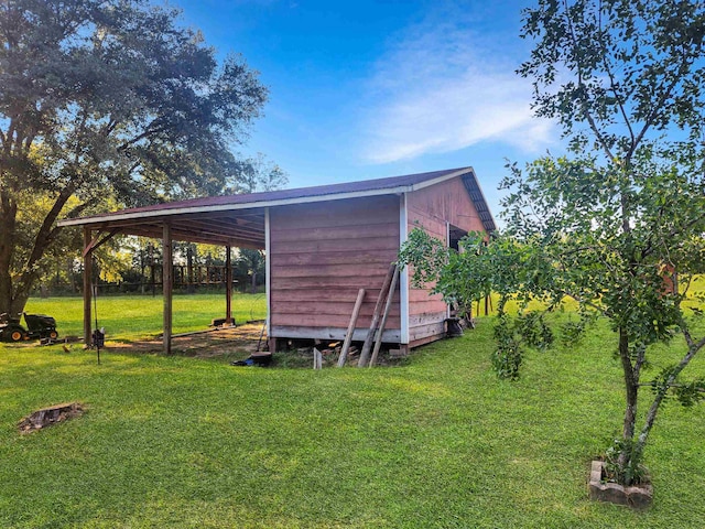 exterior space with a lawn and a carport