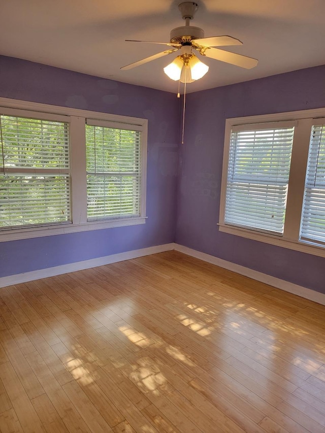 spare room with ceiling fan and light hardwood / wood-style floors