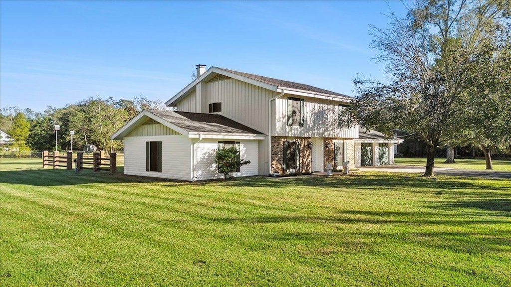 back of house with a yard