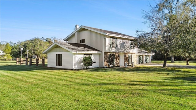 back of house with a yard