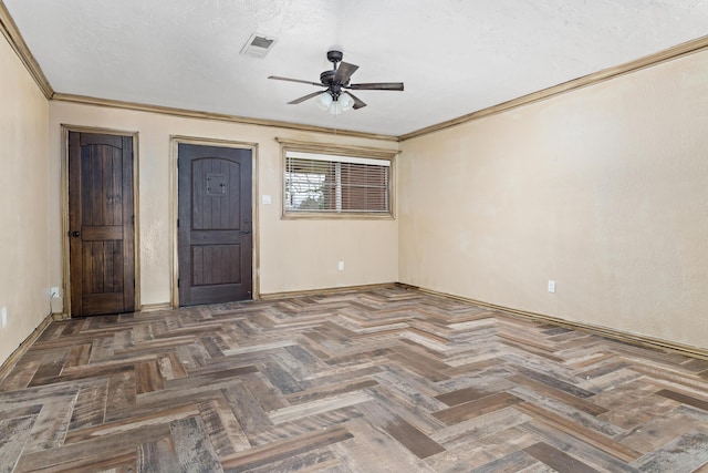 unfurnished room featuring ceiling fan, baseboards, visible vents, and crown molding