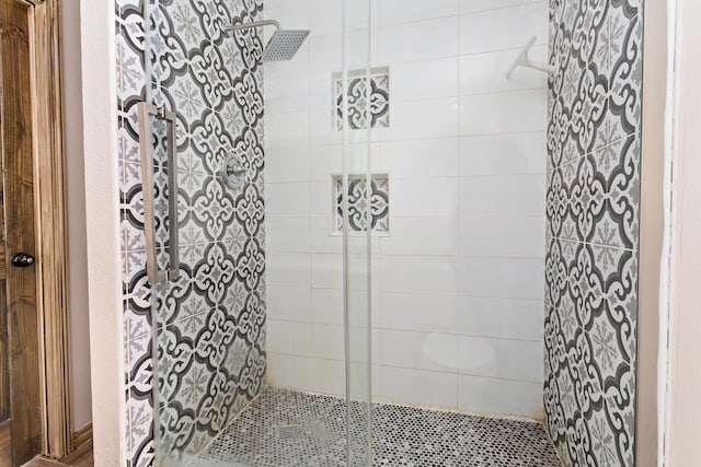 bathroom featuring a shower stall