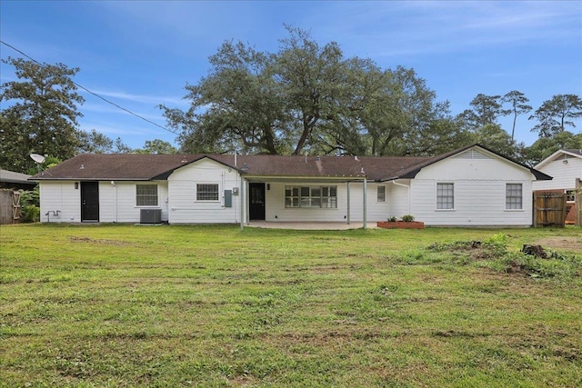 995 N 23rd St, Beaumont, TX 77706 - back of property featuring a patio and cooling unit