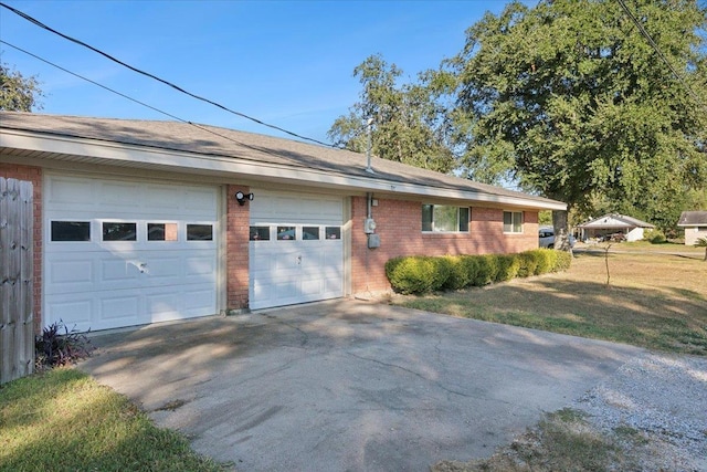 view of front of property featuring a garage and a front lawn