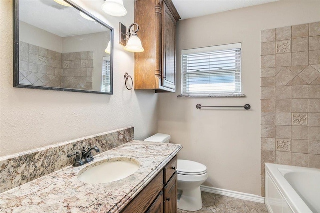 bathroom with tile patterned floors, vanity, and toilet