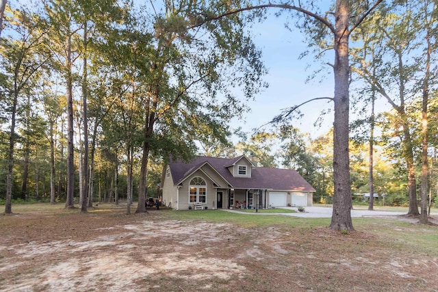 cape cod-style house with a garage