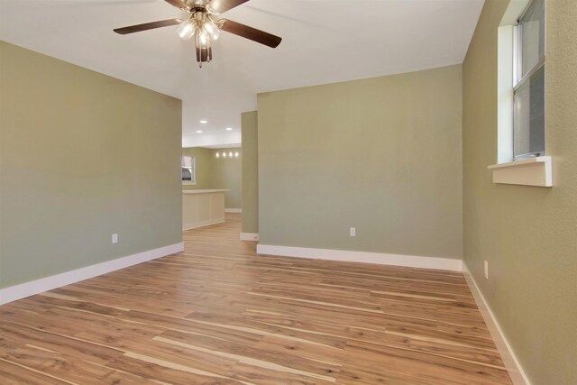 1105 W Dr, Port Neches, TX 77651 - unfurnished room with ceiling fan, light wood-style flooring, baseboards, and recessed lighting
