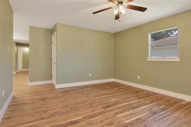 1105 W Dr, Port Neches, TX 77651 - spare room with light wood finished floors, ceiling fan, and baseboards