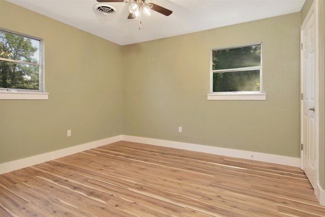 1105 W Dr, Port Neches, TX 77651 - spare room with ceiling fan, light wood-type flooring, and baseboards