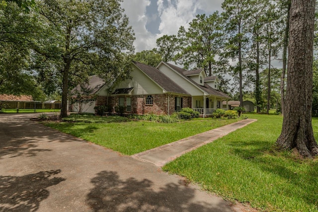 13475 Chimney Rock Dr, Beaumont, TX 77713 - view of front of home featuring brick siding and a front lawn