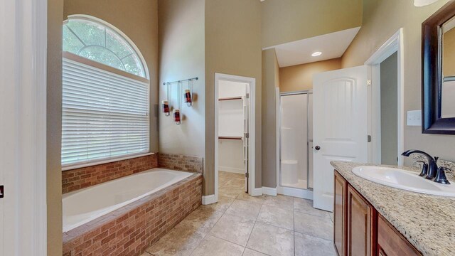 13475 Chimney Rock Dr, Beaumont, TX 77713 - full bath with a shower stall, vanity, a garden tub, tile patterned floors, and a high ceiling