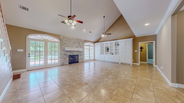 13475 Chimney Rock Dr, Beaumont, TX 77713 - unfurnished living room with a ceiling fan, high vaulted ceiling, a stone fireplace, light tile patterned floors, and recessed lighting