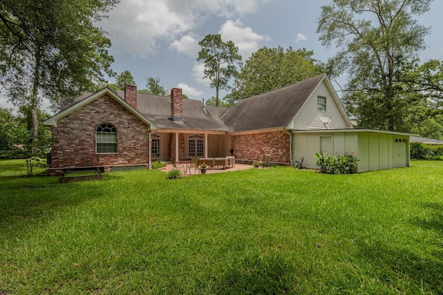 13475 Chimney Rock Dr, Beaumont, TX 77713 - rear view of property with a chimney, brick siding, a yard, and a patio area