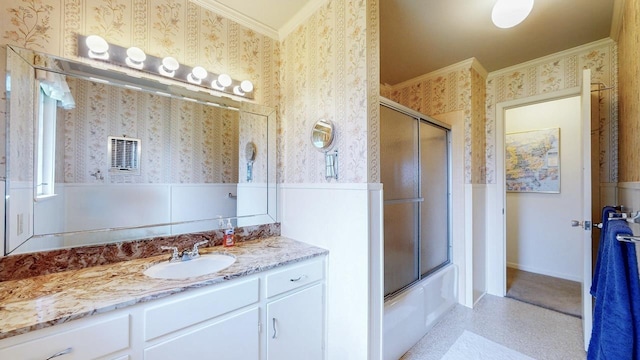6225 Pansy Dr, Beaumont, TX 77706 - full bath featuring crown molding, wallpapered walls, a wainscoted wall, vanity, and bath / shower combo with glass door